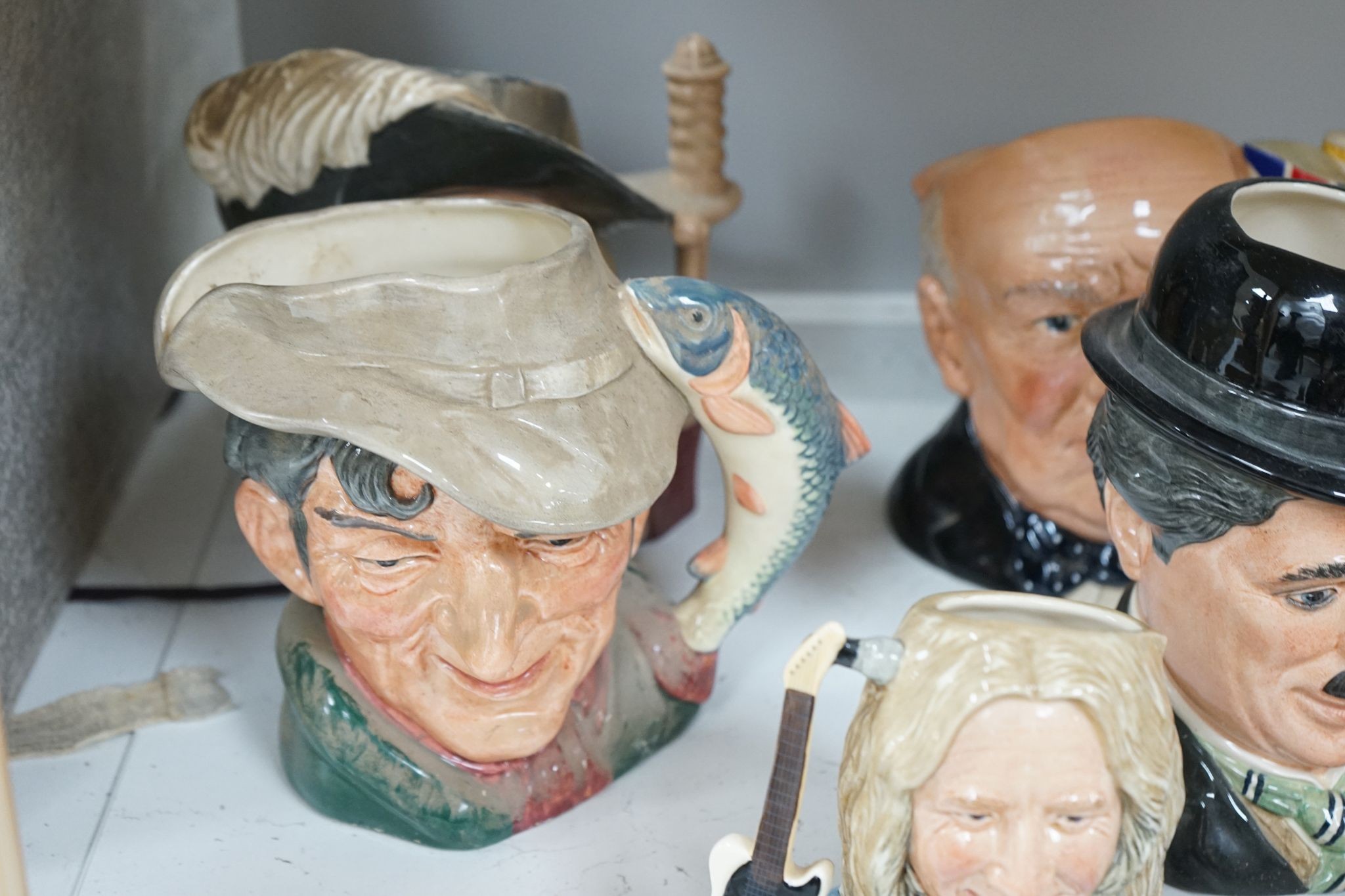 A collection of Royal Doulton character jugs, most boxed